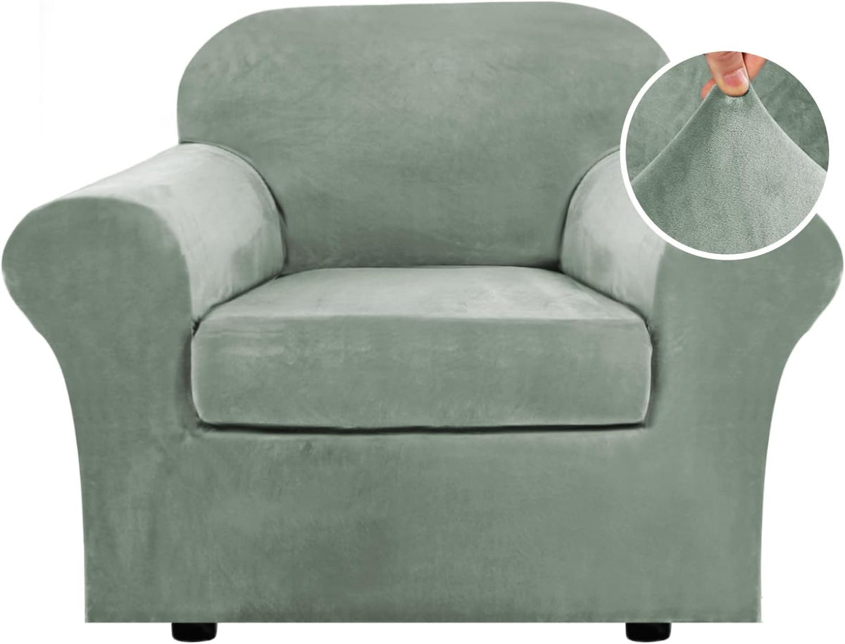 Single-seat sage-green armchair shown head-on, rolled arms and a fabric texture inset at top right.