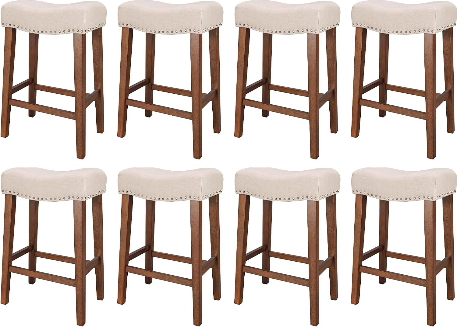 Eight backless counter stools with beige fabric saddle seats and wooden legs, arranged in two rows on white background.