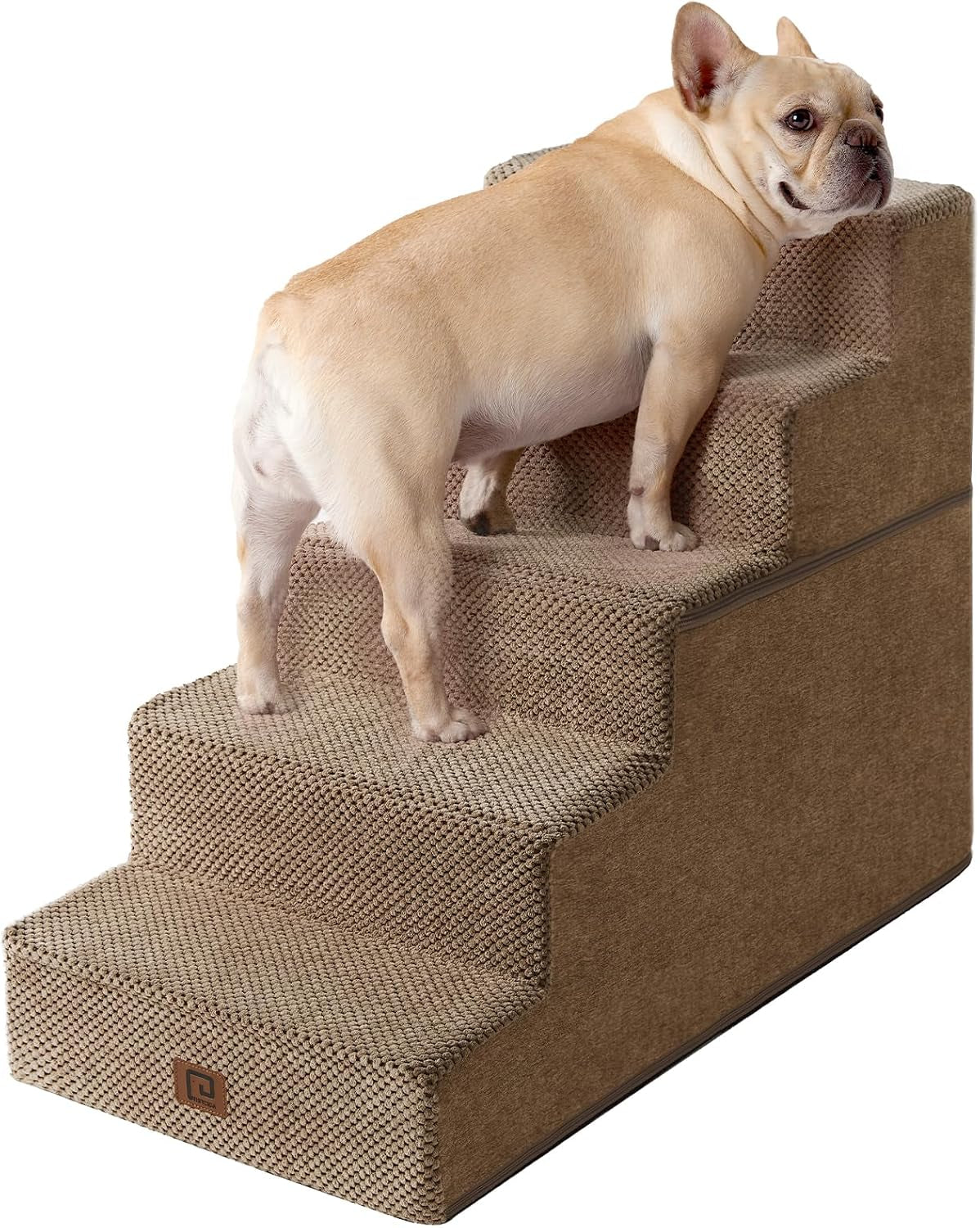 Brown four-step stairs seen at a three-quarter angle with a tan French bulldog climbing upward