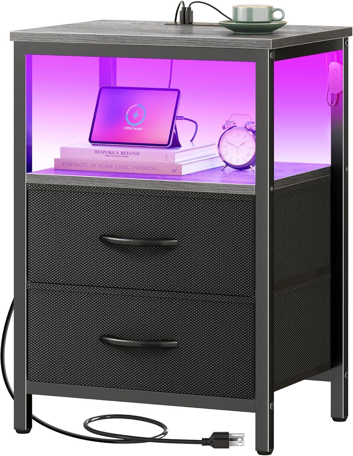 Nightstand with black fabric-front drawers, purple-lit open shelf and top charging outlet with cup on top.