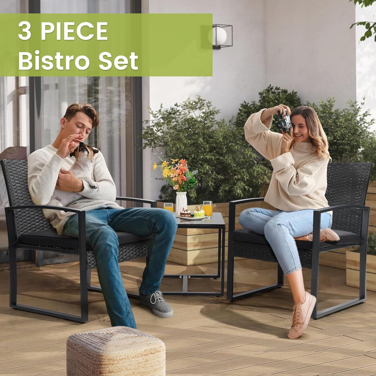 Lifestyle scene of two people seated on the bistro set on a deck using the glass-top table