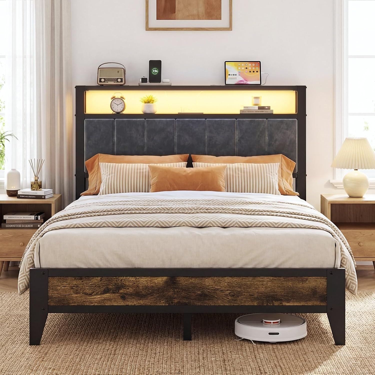 Front view of full-size platform bed with padded gray headboard, illuminated headboard shelf and rustic footboard