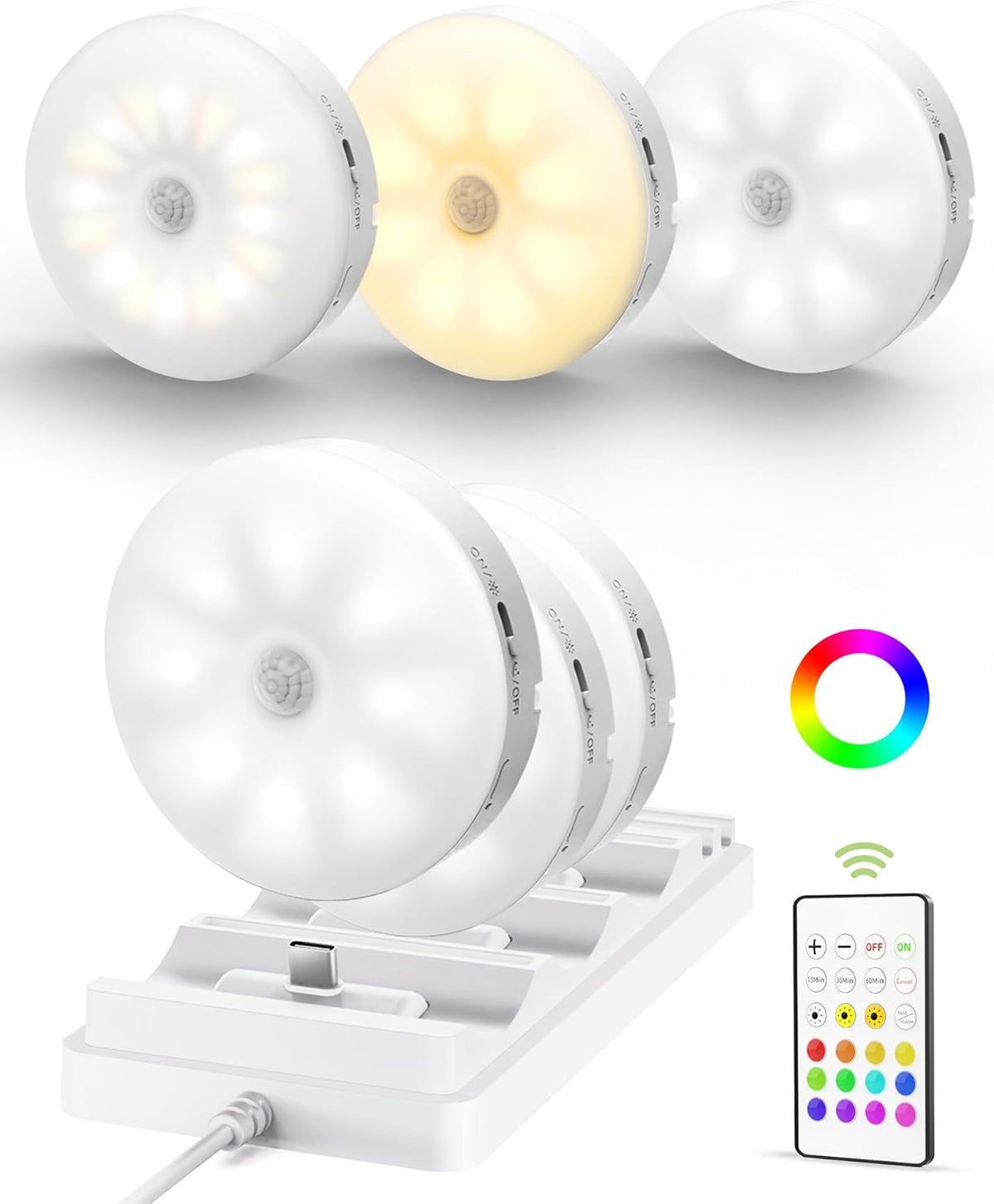 Three puck lights seated on a white charging dock with visible USB-C charger pin and remote at right.