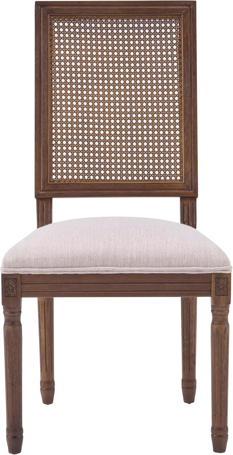 Straight-on front view of the dining chair showing rectangular cane back and padded beige seat.