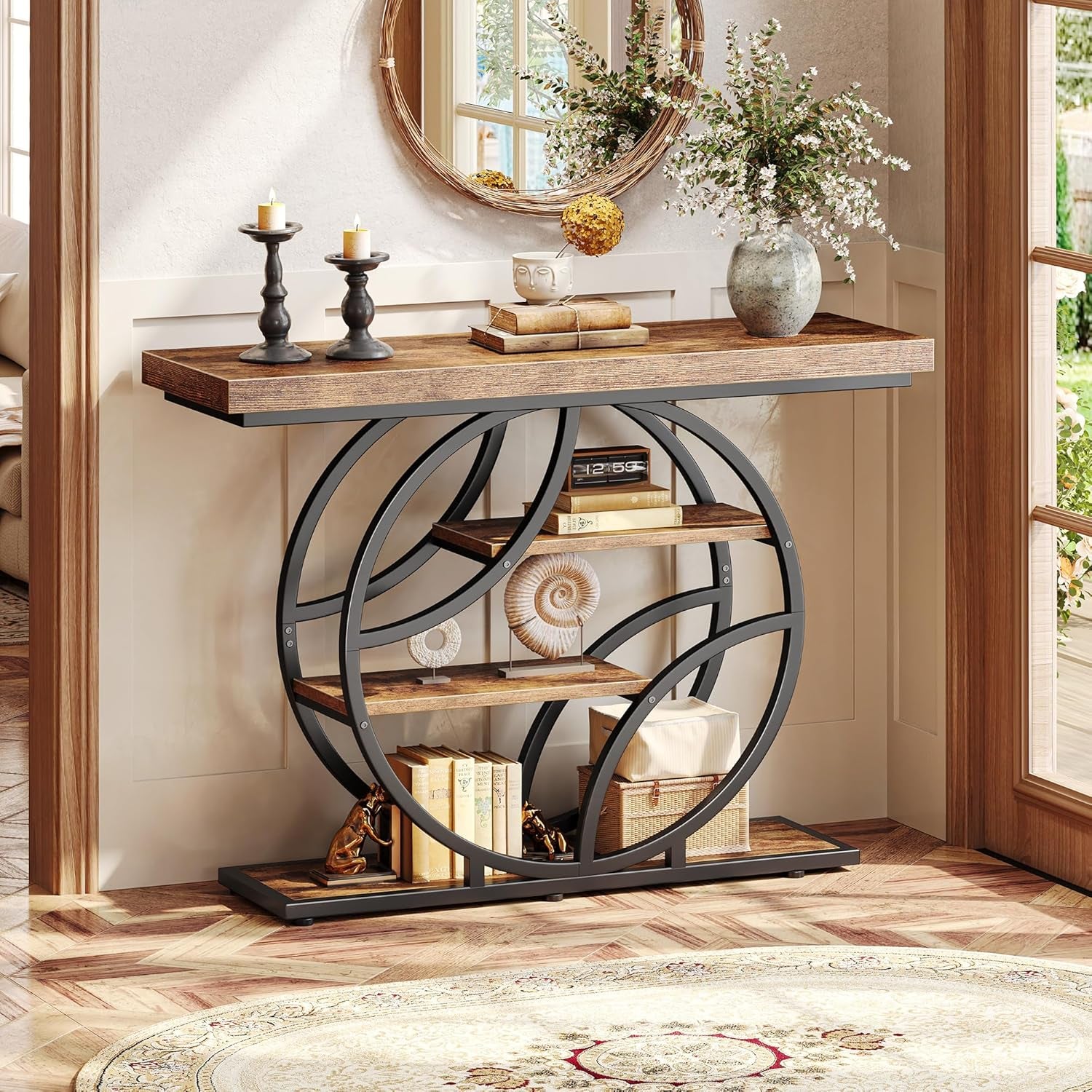 Console table in rustic brown and black metal shown in a foyer with mirror and decor, front view
