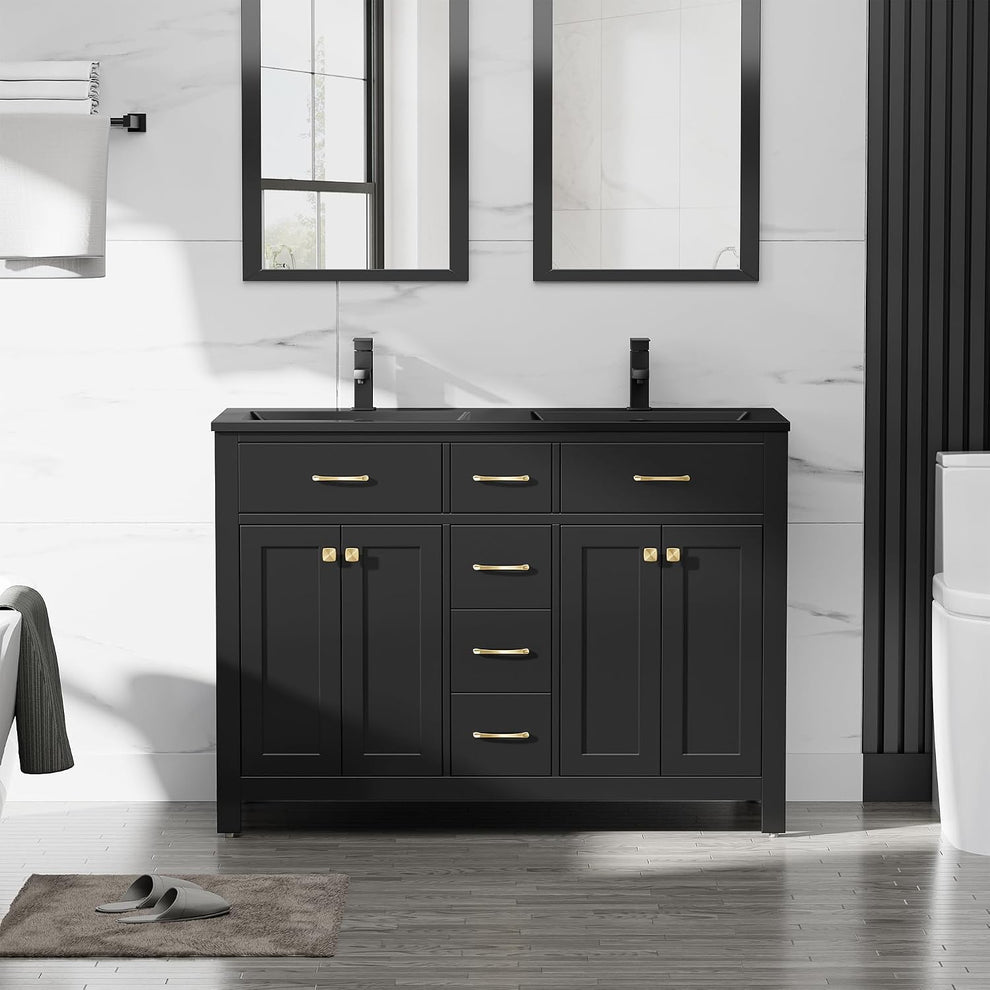 Front view of a black single-sink vanity with gold hardware, two mirrors above and a towel rack at left.