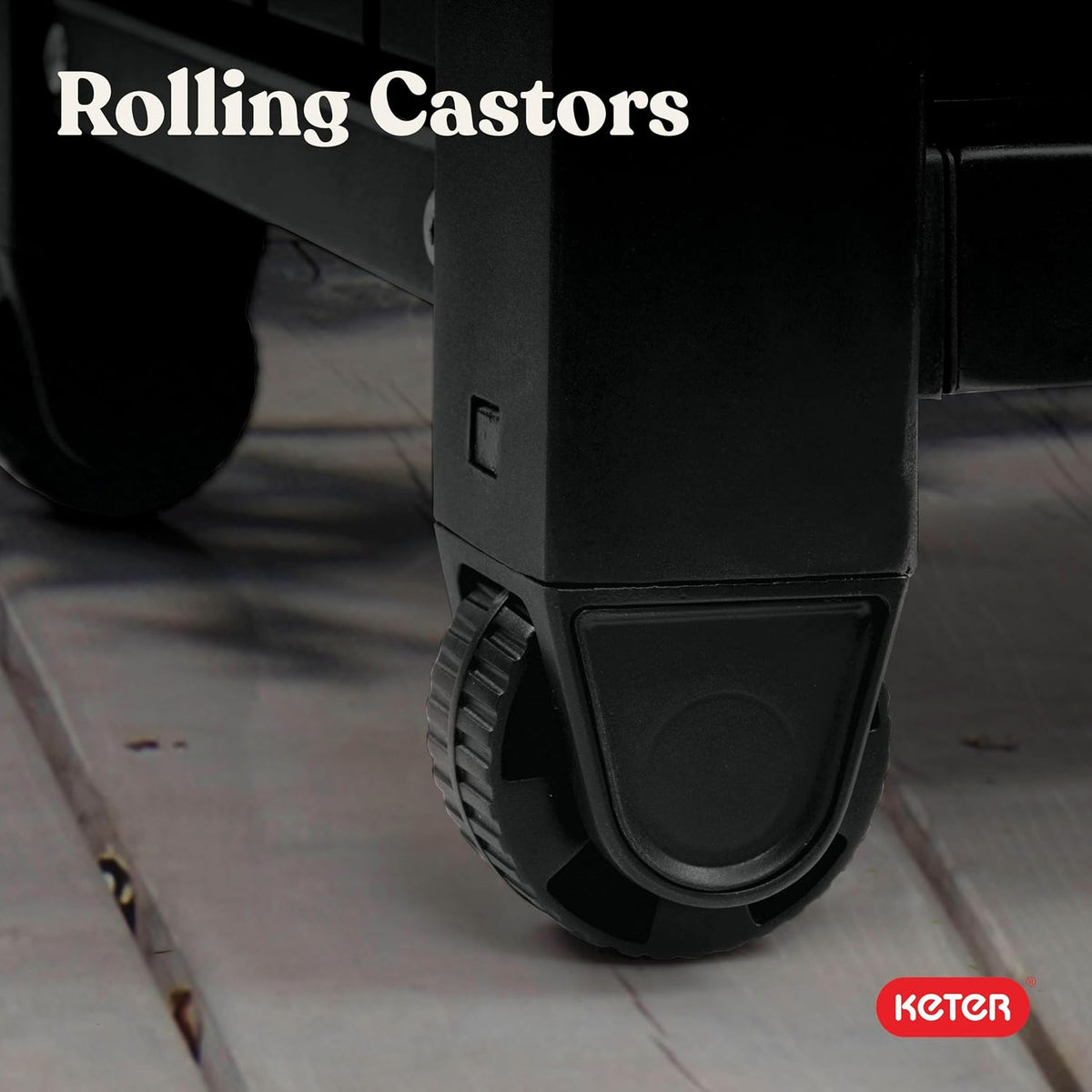 Close-up of a black rolling caster wheel attached to the cart leg on a deck surface