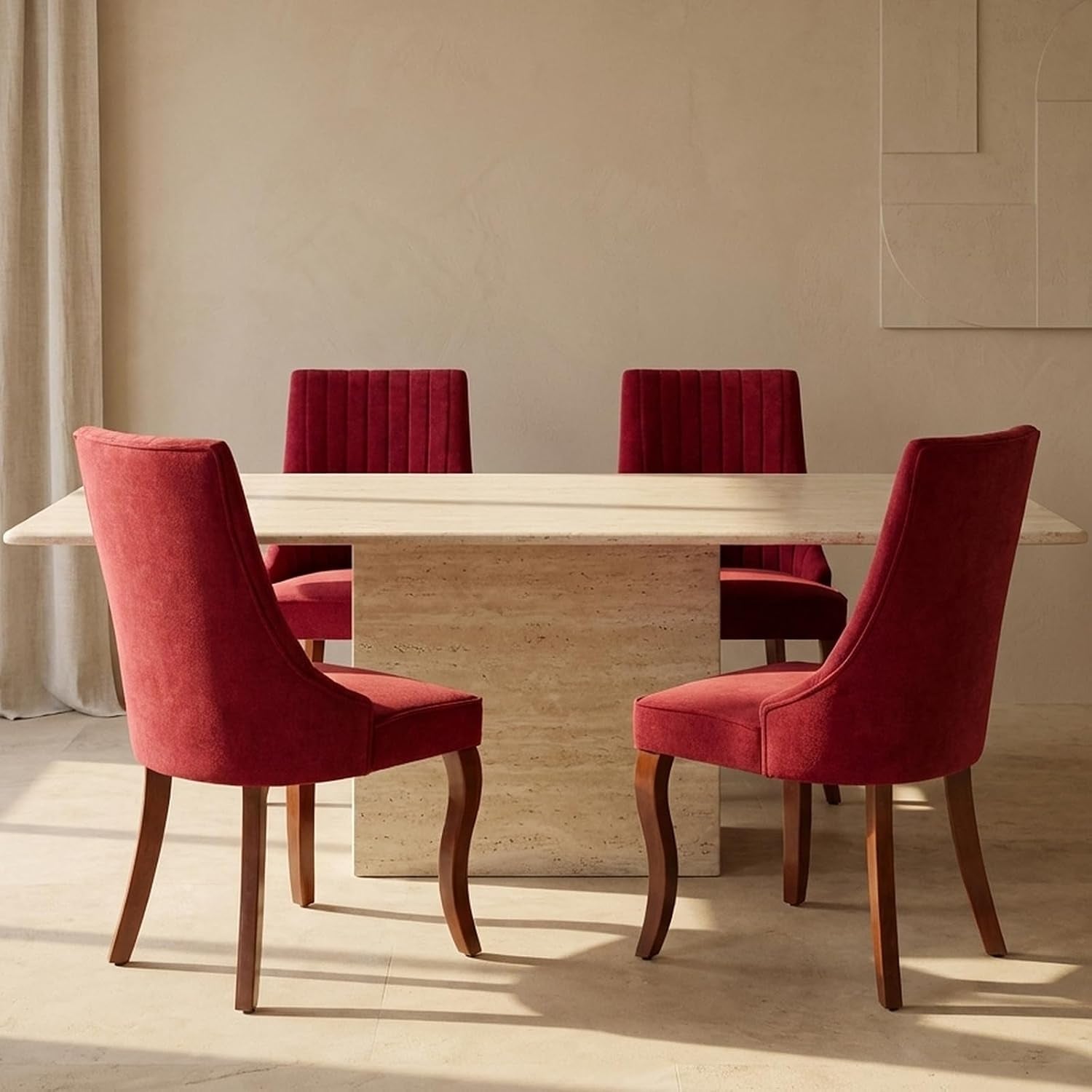 Main shot of four red upholstered high-back chairs positioned around a rectangular stone dining table.