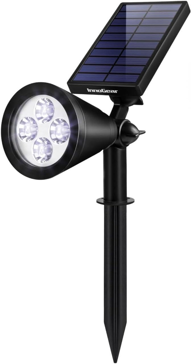 Single black solar spotlight on stake with conical head, four LEDs and a rectangular solar panel above.