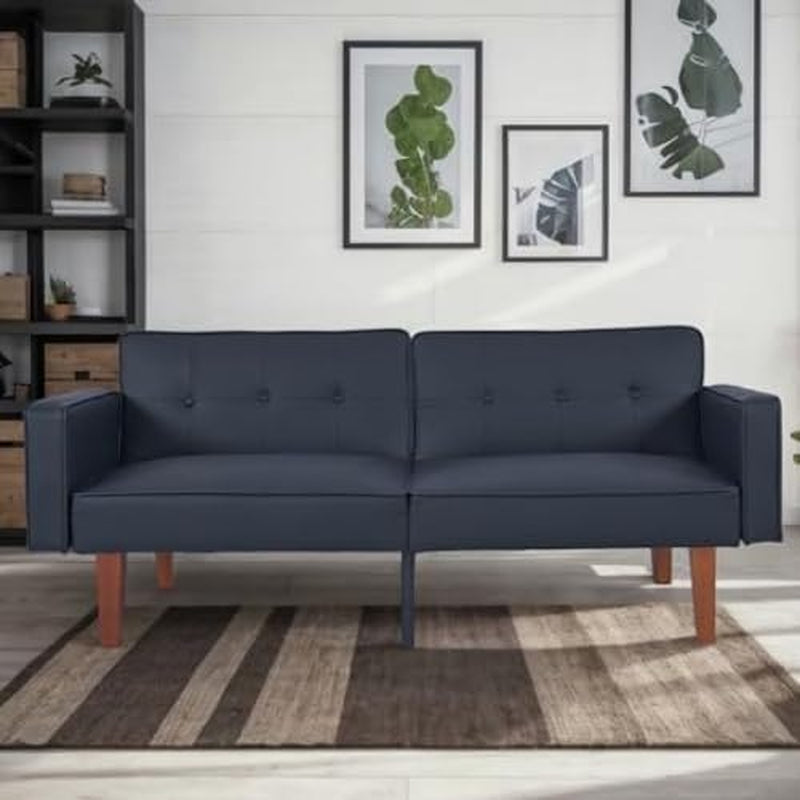 Dark navy futon sofa with straight arms shown in a styled room with framed botanical prints.