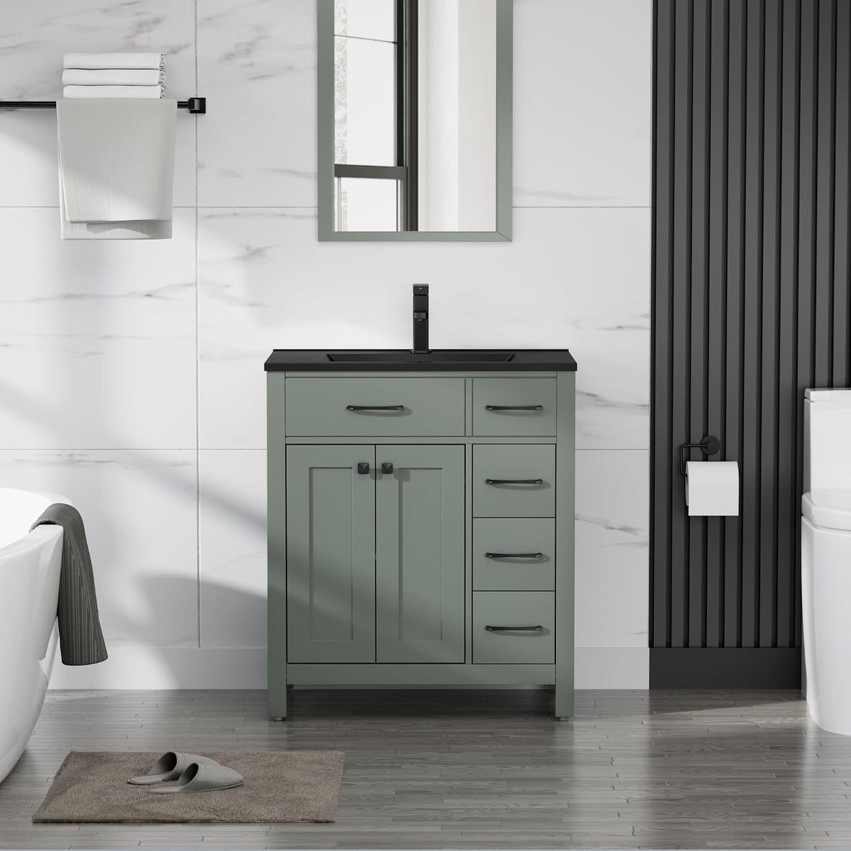 Narrow sage-green single-sink vanity with black sink and faucet, towel rack and toilet at right.