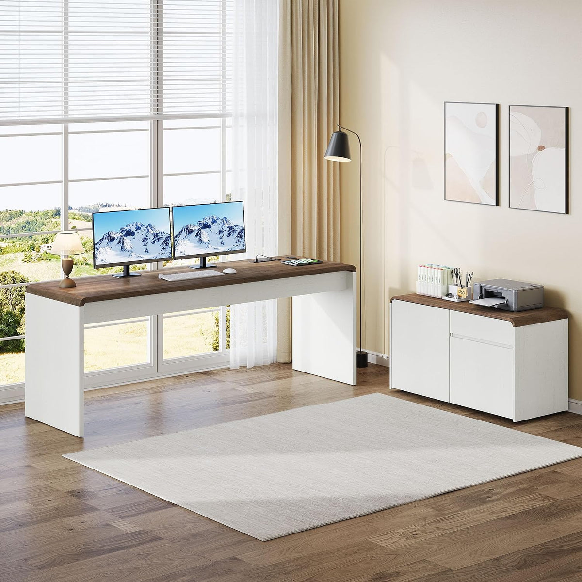White desk with walnut top arranged in an L-shaped layout in a bright living room, front-left angled view with dual monitors