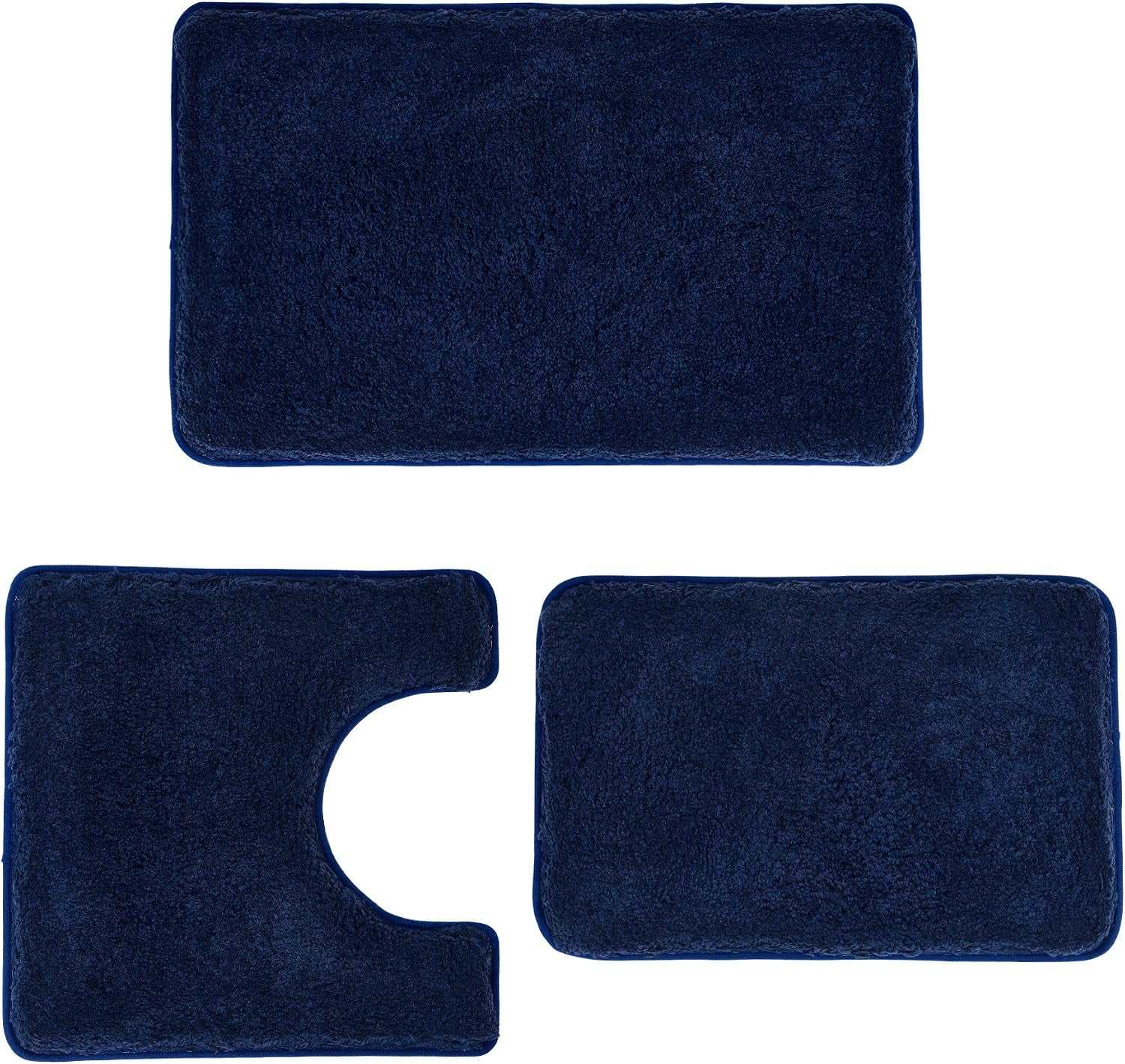 Three-piece deep navy blue bath rug set arranged flat, showing U-shaped toilet mat and two rectangular mats