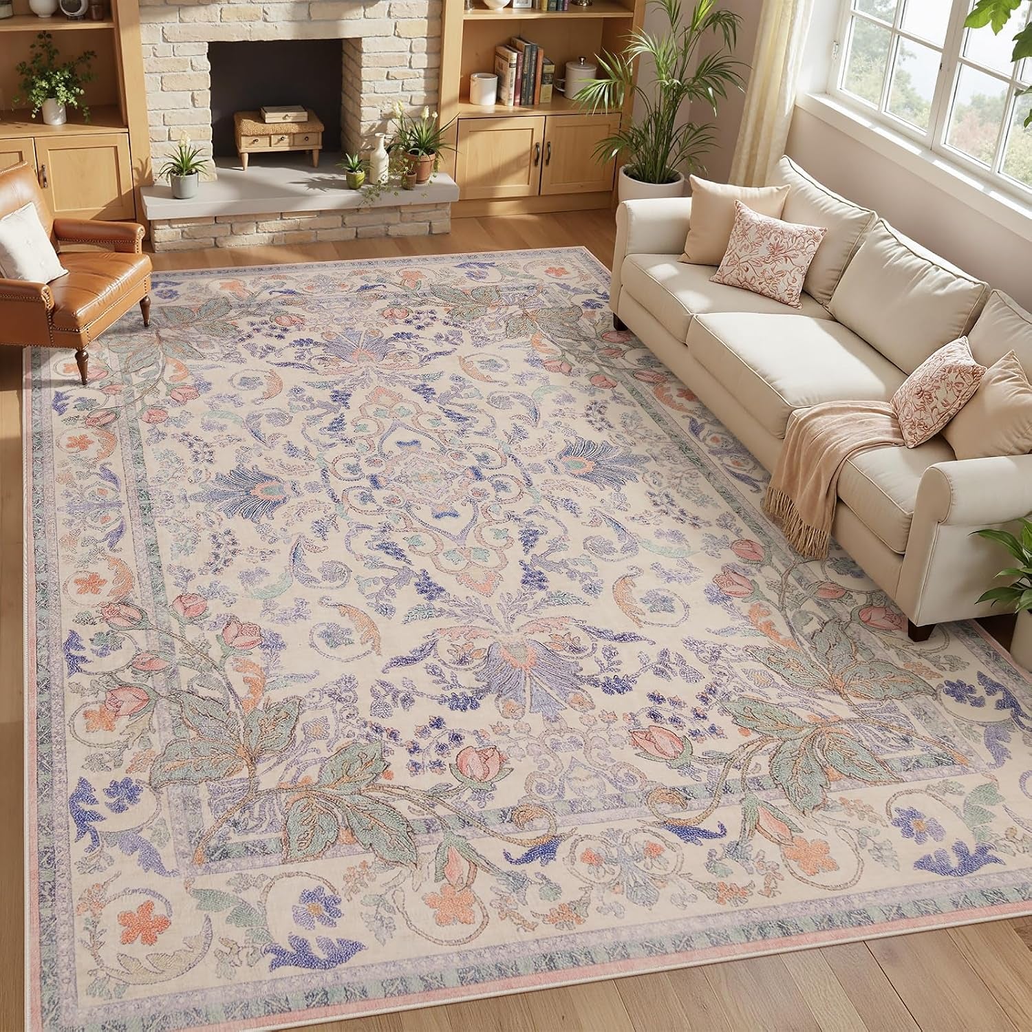 Top-down living room view of the same beige medallion rug with lavender-blue floral highlights beside a cream sofa and