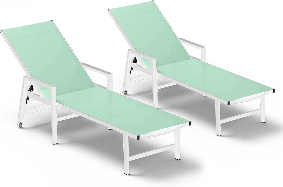 Two mint-green chaise lounges with white frames side by side on a studio white background.