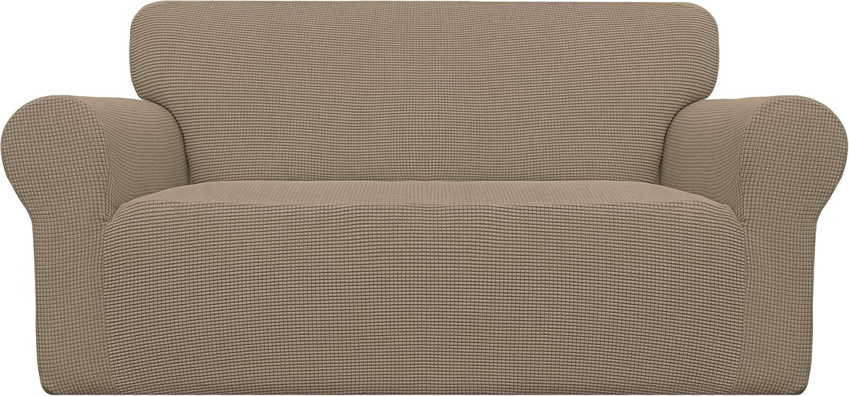 Front view of a loveseat wrapped in a warm taupe waffle-textured stretch cover