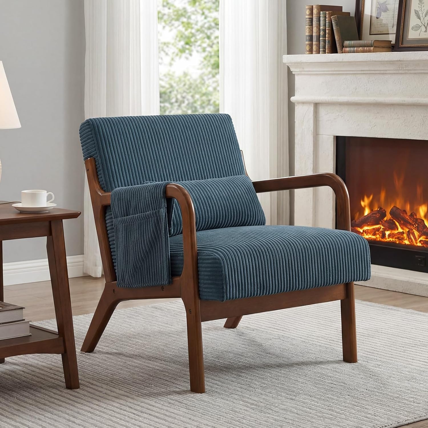 Single blue upholstered wood-frame chair with lumbar pillow placed near a fireplace and side table.