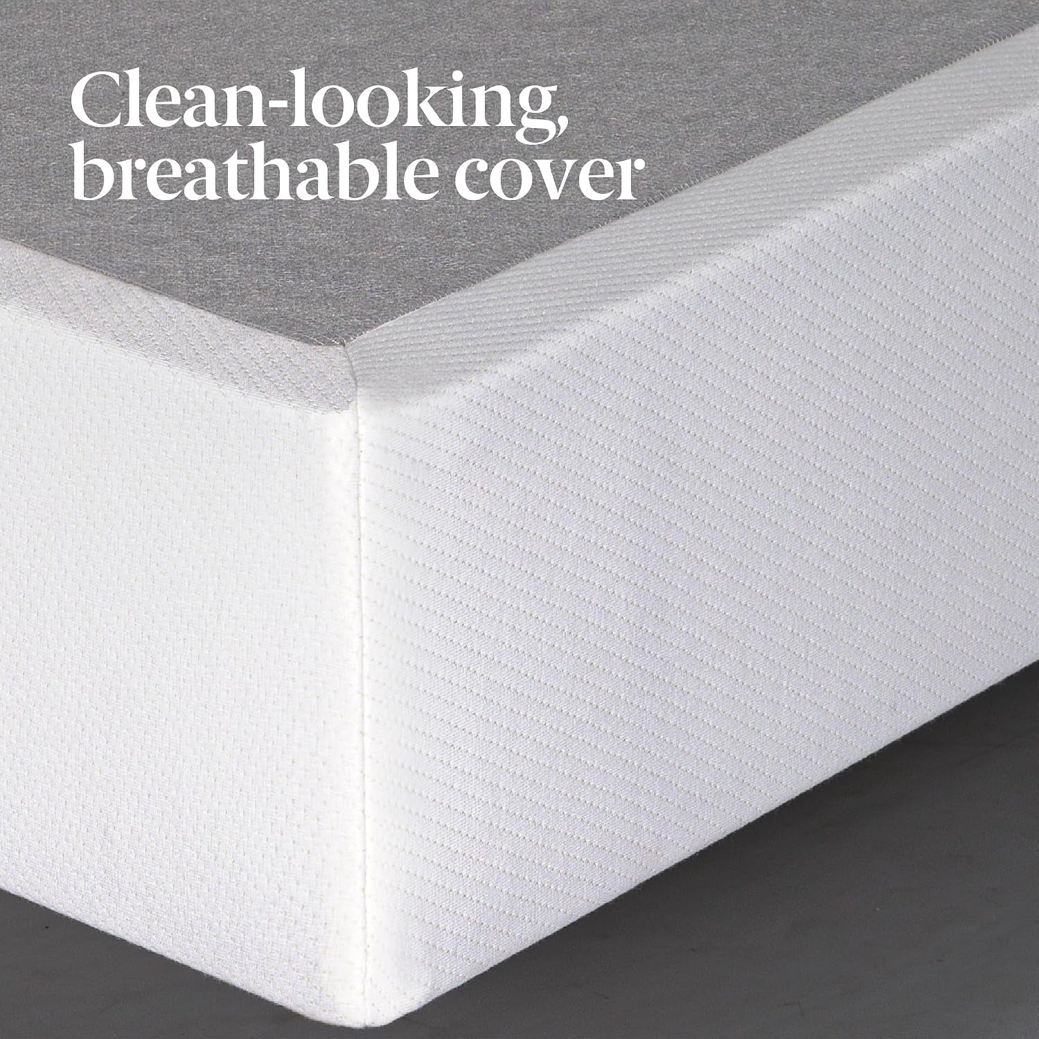 Close-up of white fabric-covered foundation corner with grey top panel visible