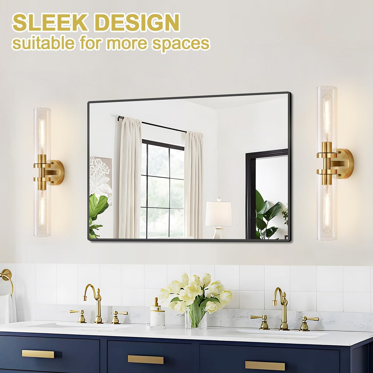Single rectangular mirror flanked by two vertical gold tube sconces over navy vanity