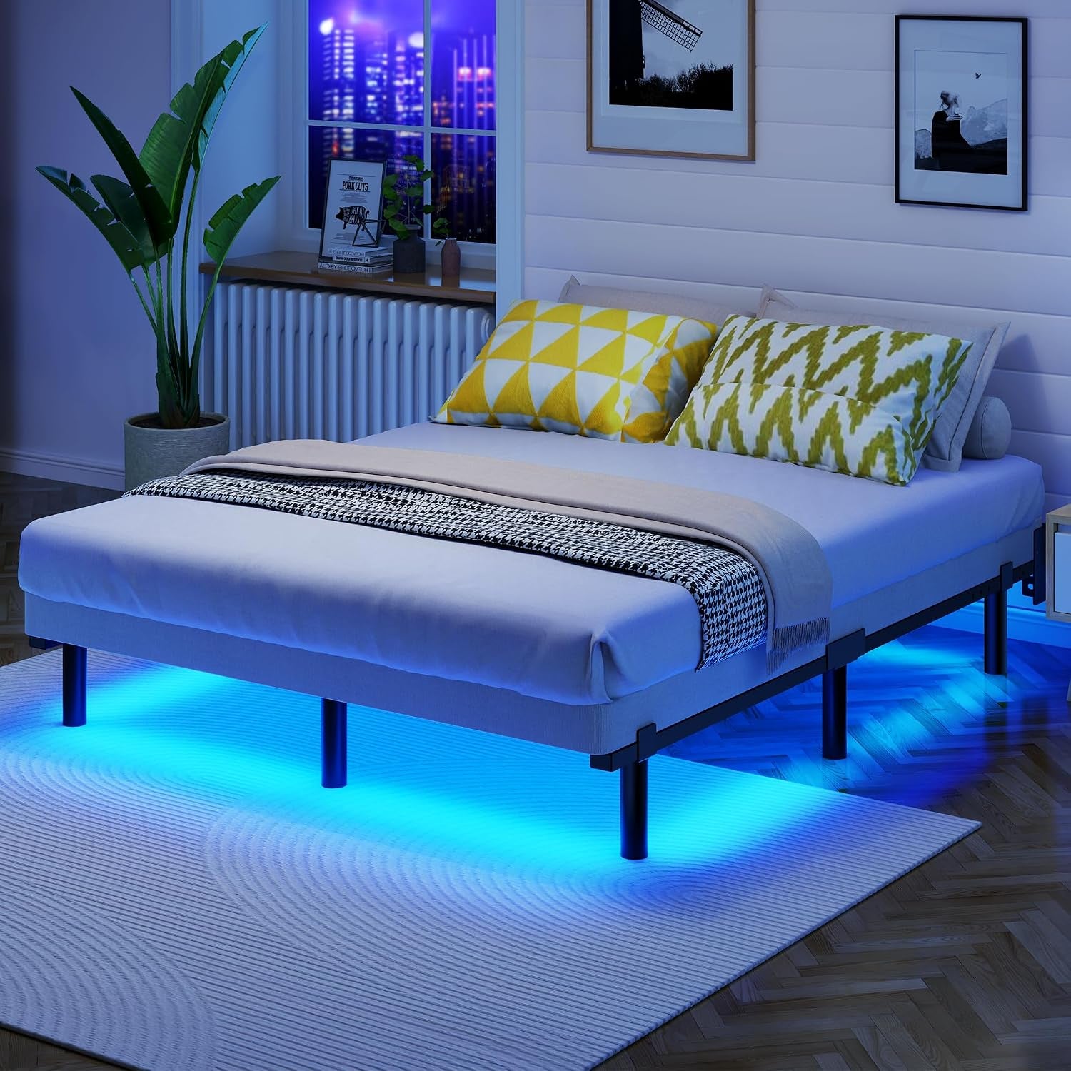 King-size bed in a dimly lit bedroom with blue LED glow under the frame and patterned yellow-green pillows