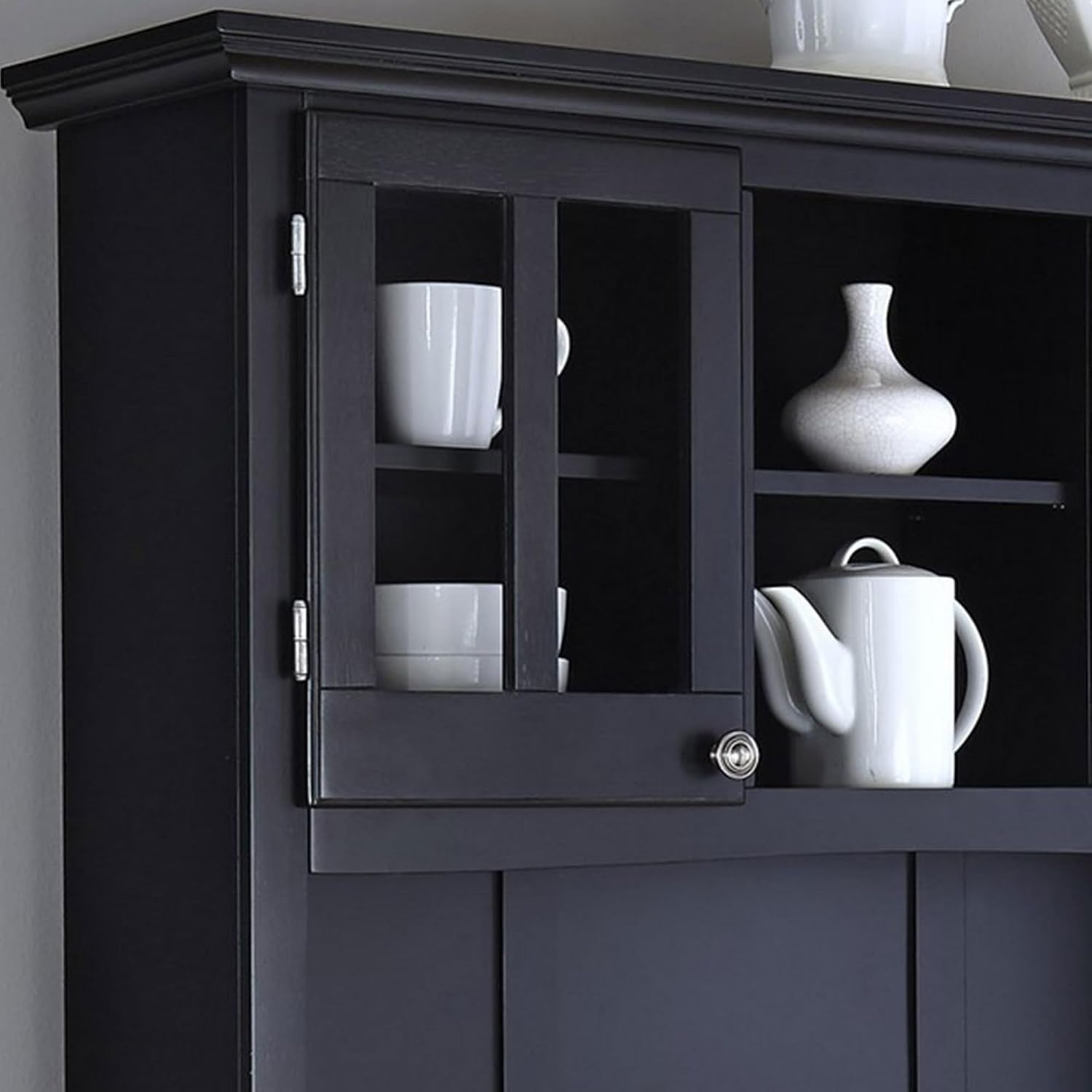 Upper hutch left glass-front door open, interior shelves holding white teapot and dishes