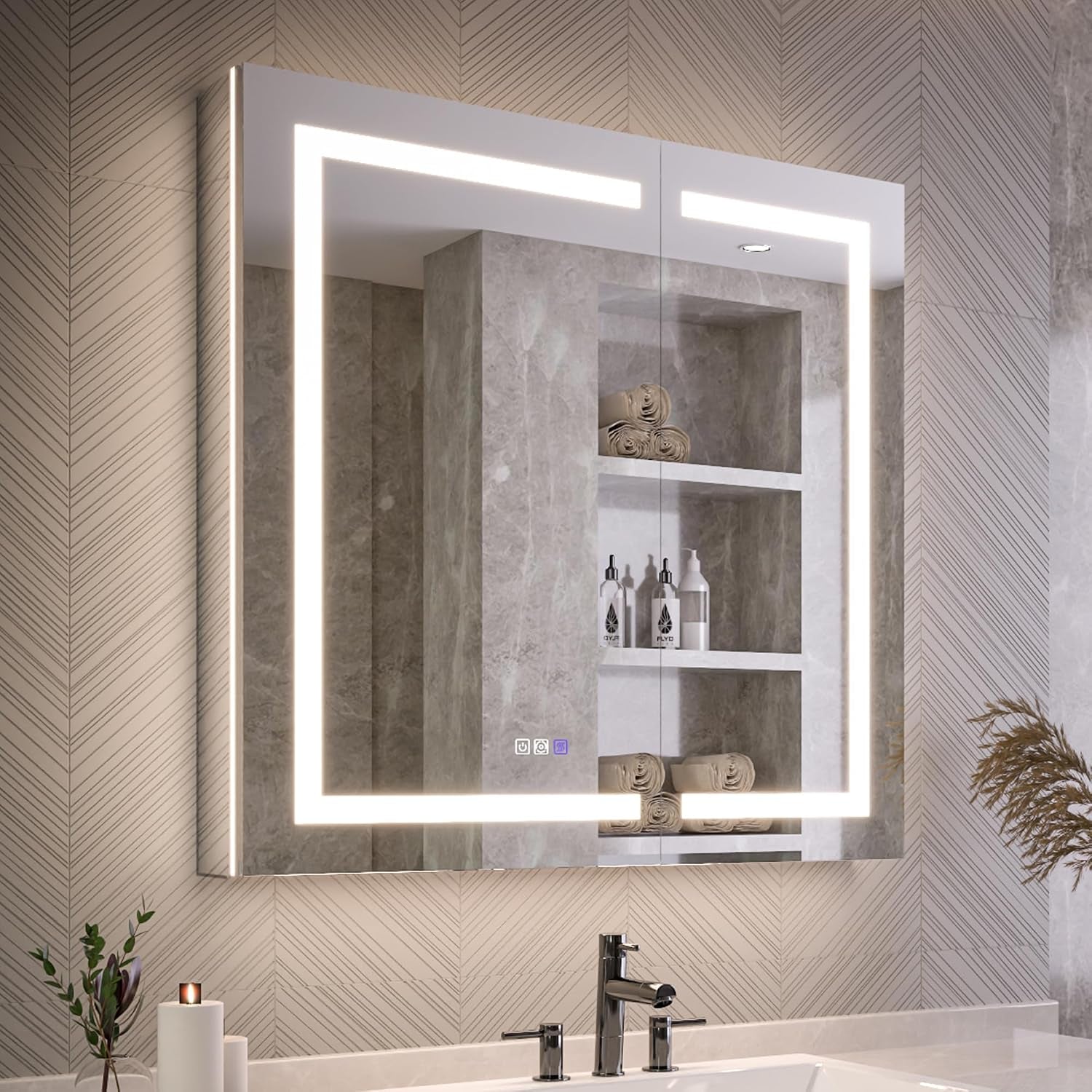 Lit mirrored cabinet above a sink reflecting recessed shelves and rolled towels in a neutral bathroom.