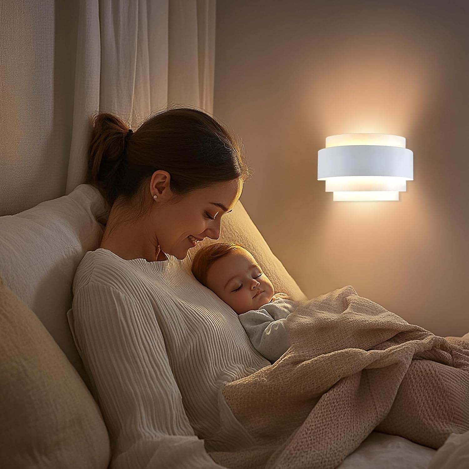 White half-moon metal wall sconce lit above a mother and baby in a cozy bedroom setting