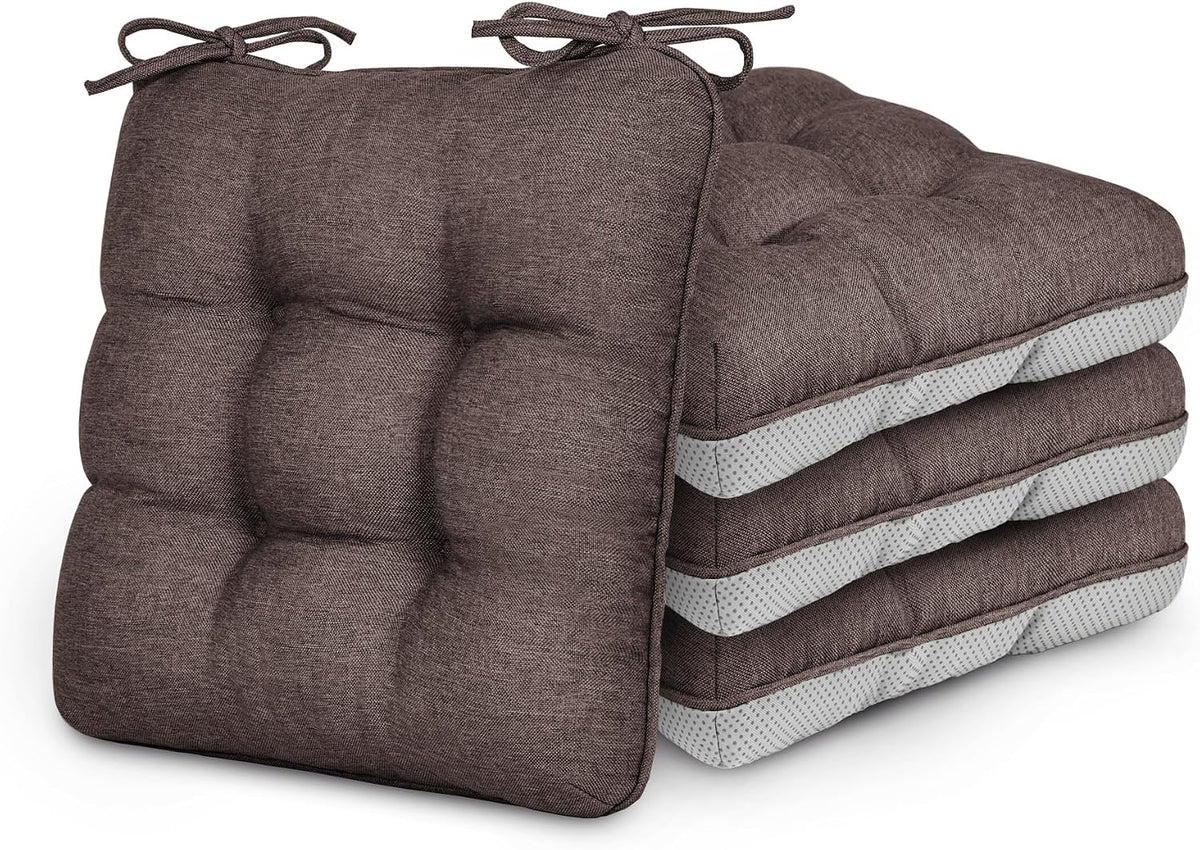 Four brown tufted seat cushions stacked, showing ties and dotted non-slip undersides