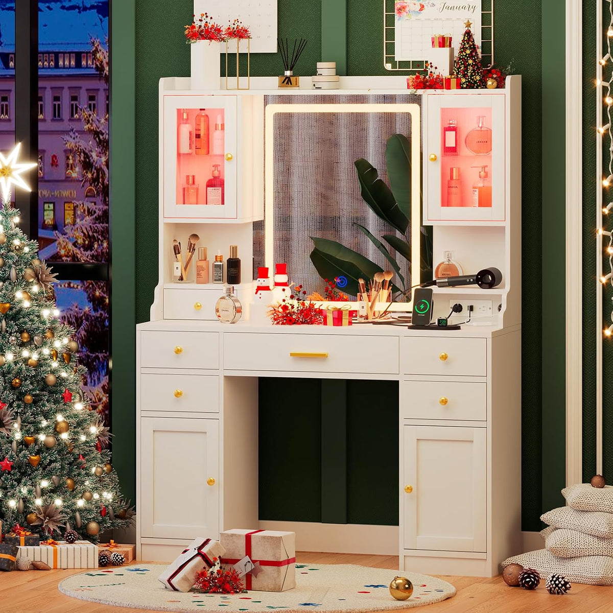 White vanity decorated for the holidays with red-tinted cabinet lights, mirror glow, and wrapped gifts nearby