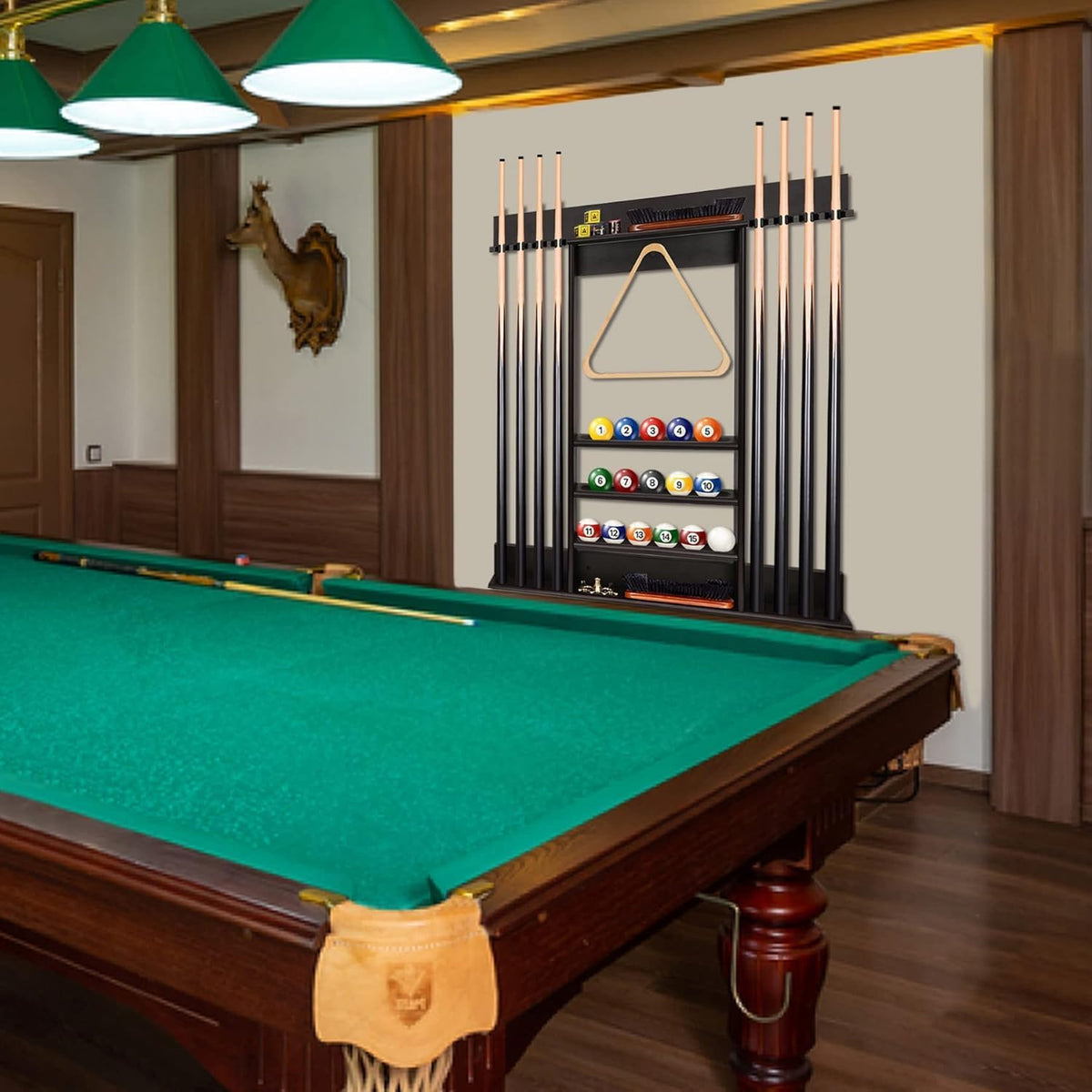 Pool room view showing a mounted cue rack with cues, triangle and ball shelves beside a billiards table.