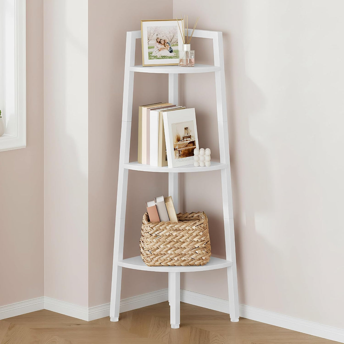 Close-up of white shelf tiers showing a woven basket and stacked books in the corner