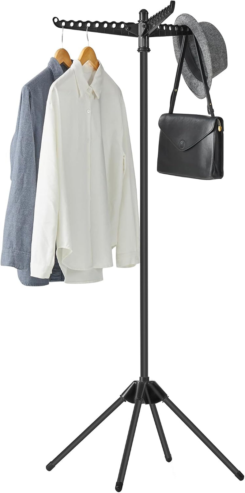 Full-height black drying rack with three rotating arms holding two shirts, a hat and a black shoulder bag.