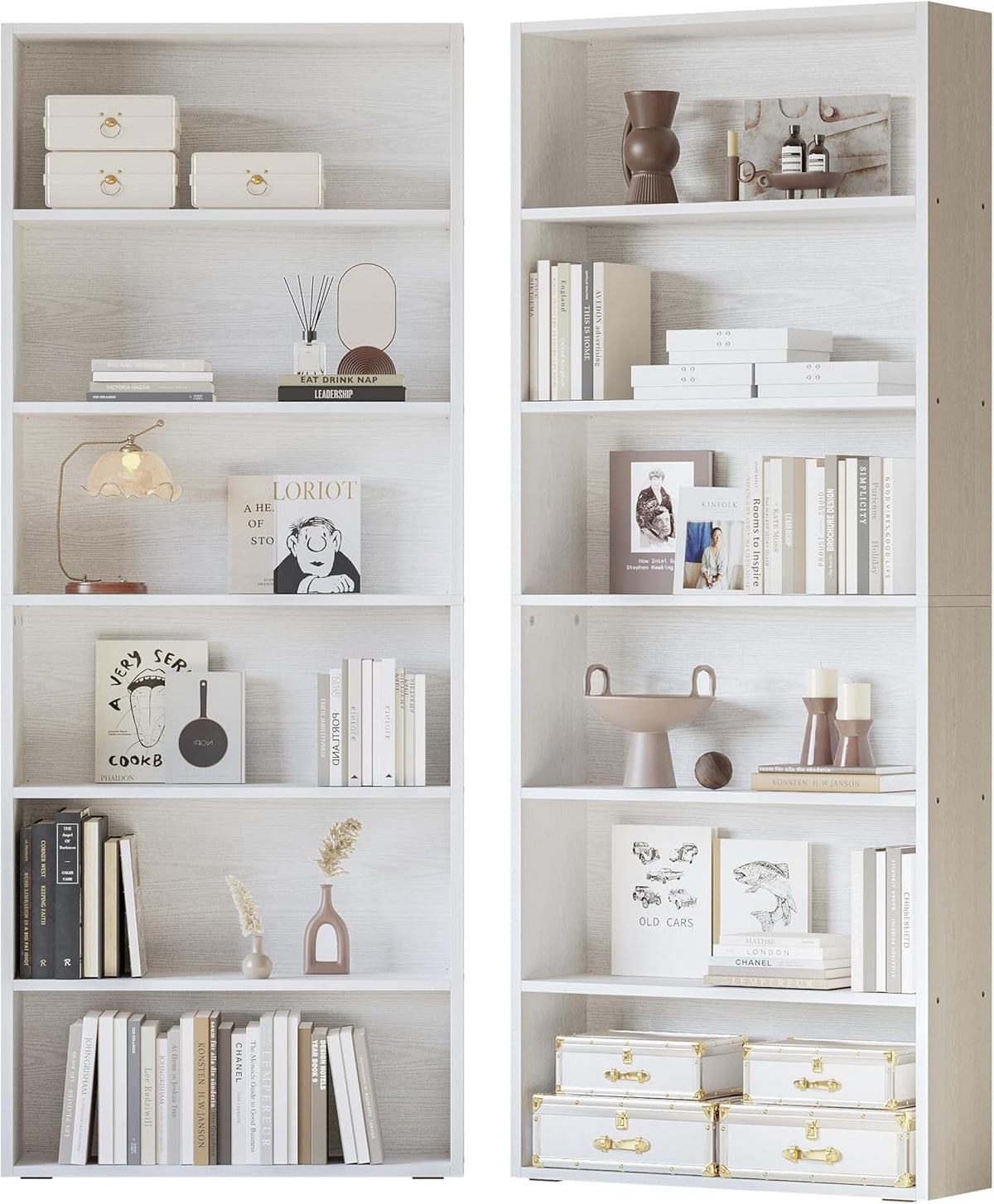 Two tall whitewashed 6-tier bookcases side-by-side styled with books and decor against a white background