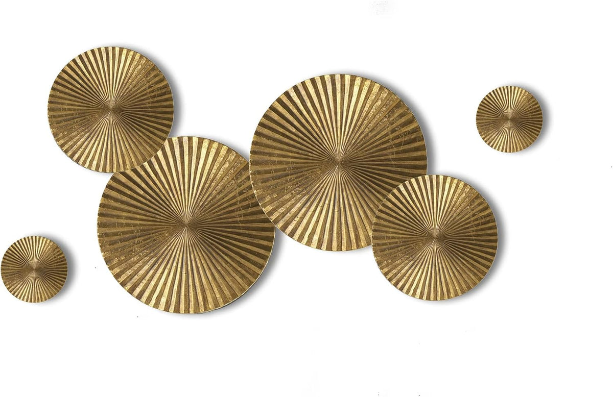 Gold sunburst metal circles arranged flat on a white background showing overlapping large and medium pieces