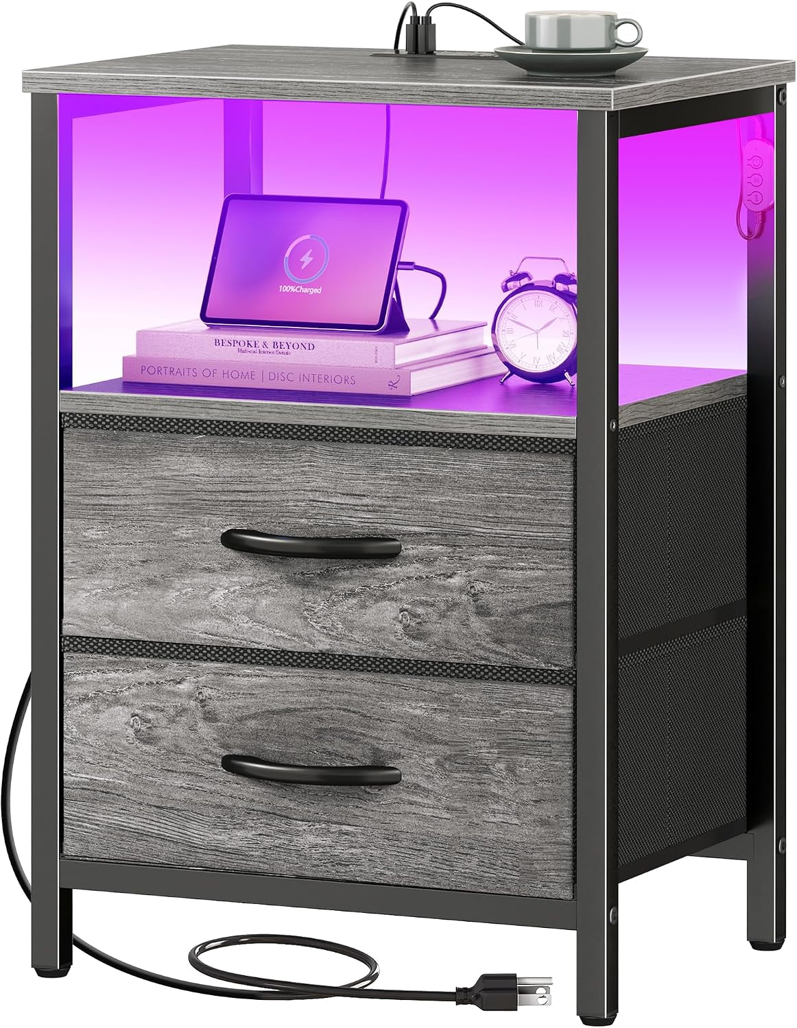 Nightstand with gray wood drawer fronts, black metal frame, purple LED-lit open shelf, top cup and visible power cord.