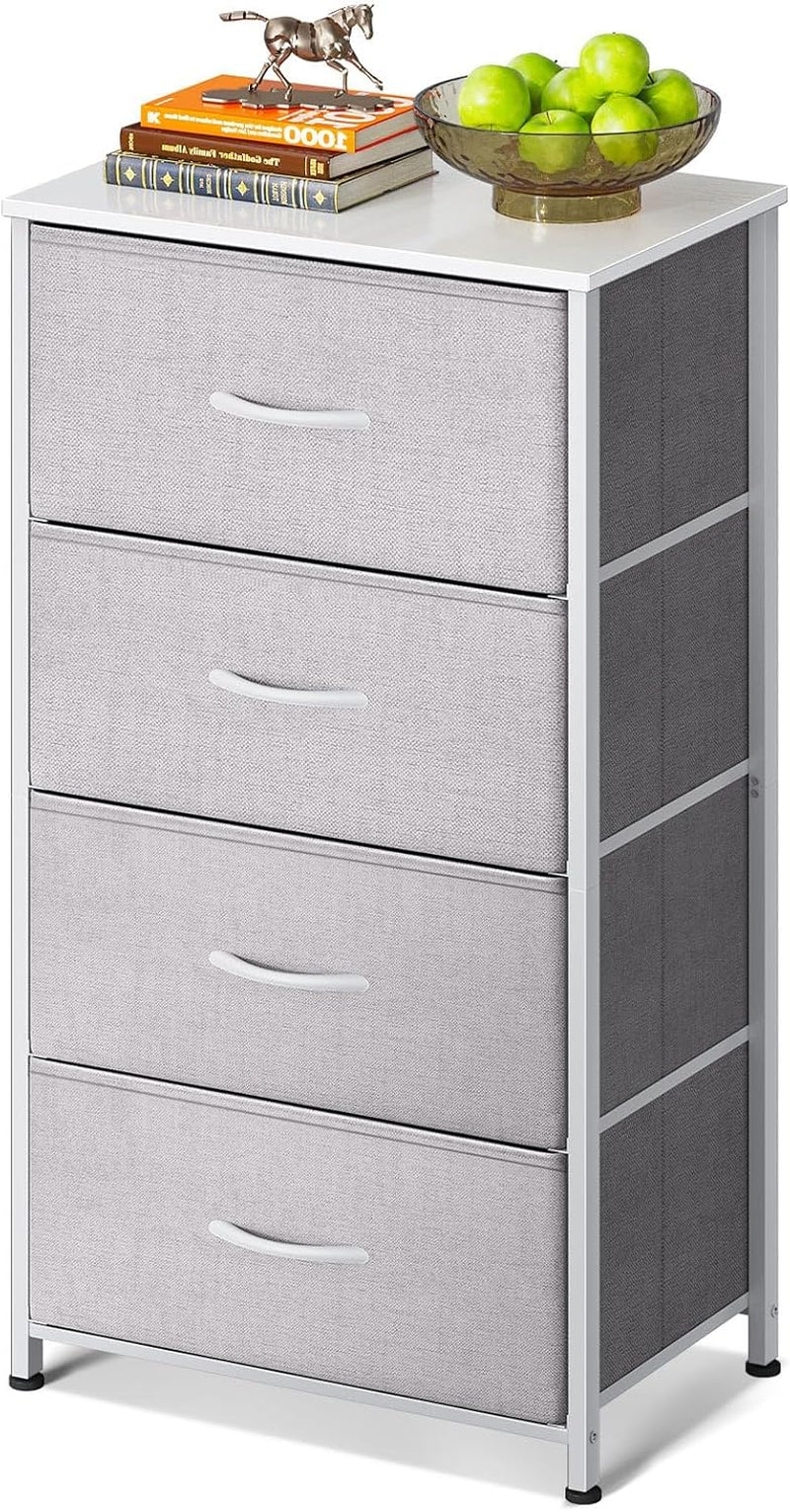 Narrow four-drawer dresser with light gray fabric drawers, white metal frame and white top styled with books and a bowl.
