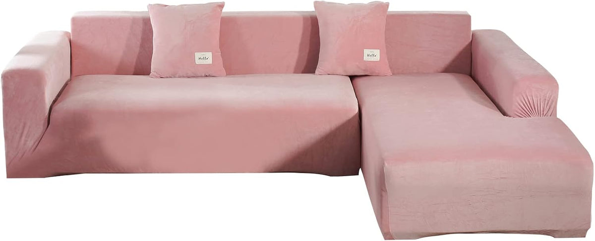 Front view of L-shaped sectional in dusty pink velvet slipcover with chaise on the right and three matching pillows.