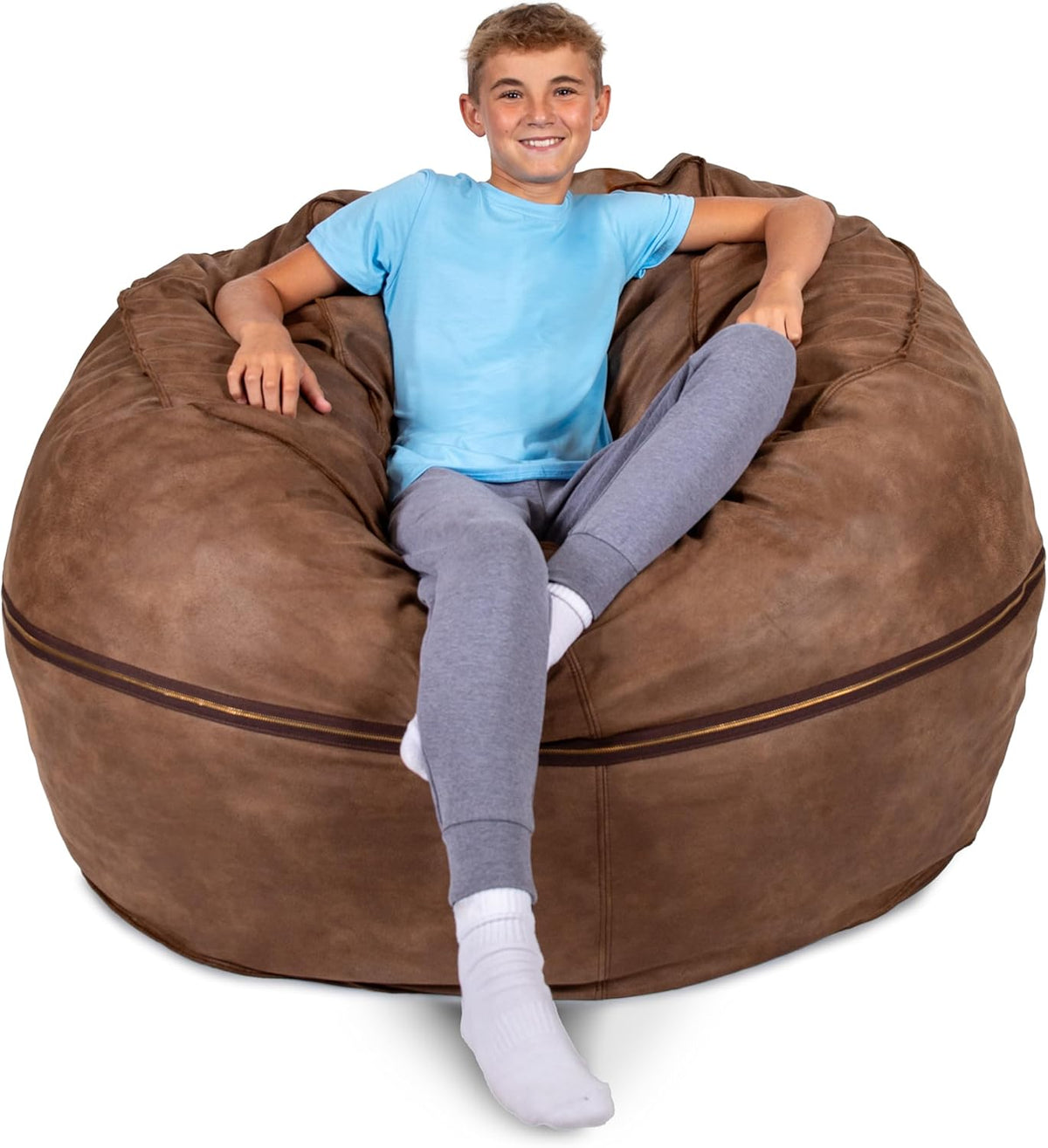 Boy reclining in a large brown bean bag with visible zipper detail around the middle