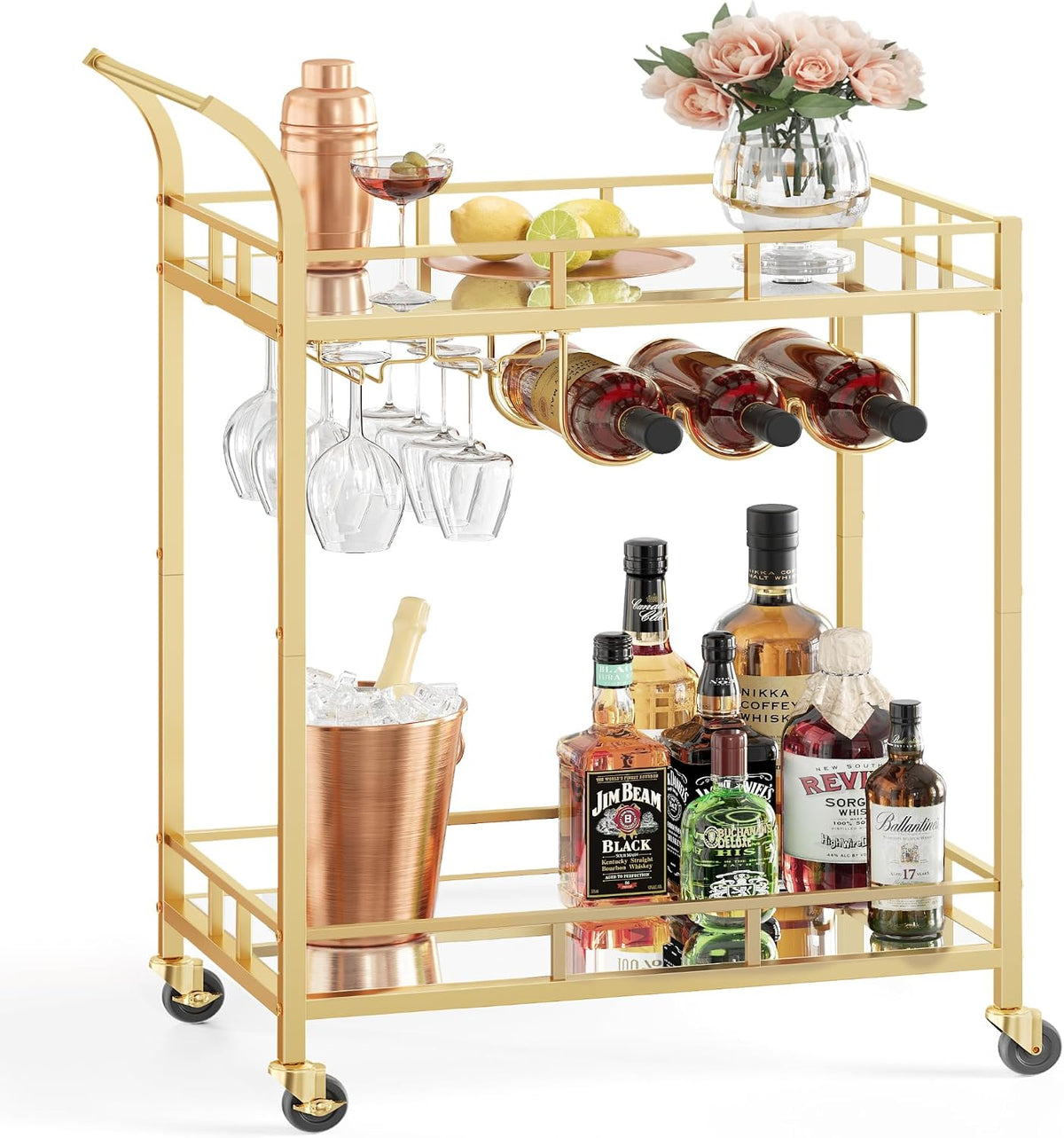 Angled front view of a gold metal bar cart stocked with bottles, ice bucket, hanging wine glasses and a vase on the top