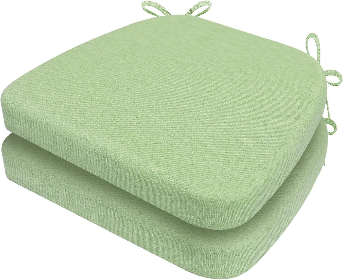Two mint green D-shaped cushions stacked offset, showing top surface, side profile and tie loops at the corners