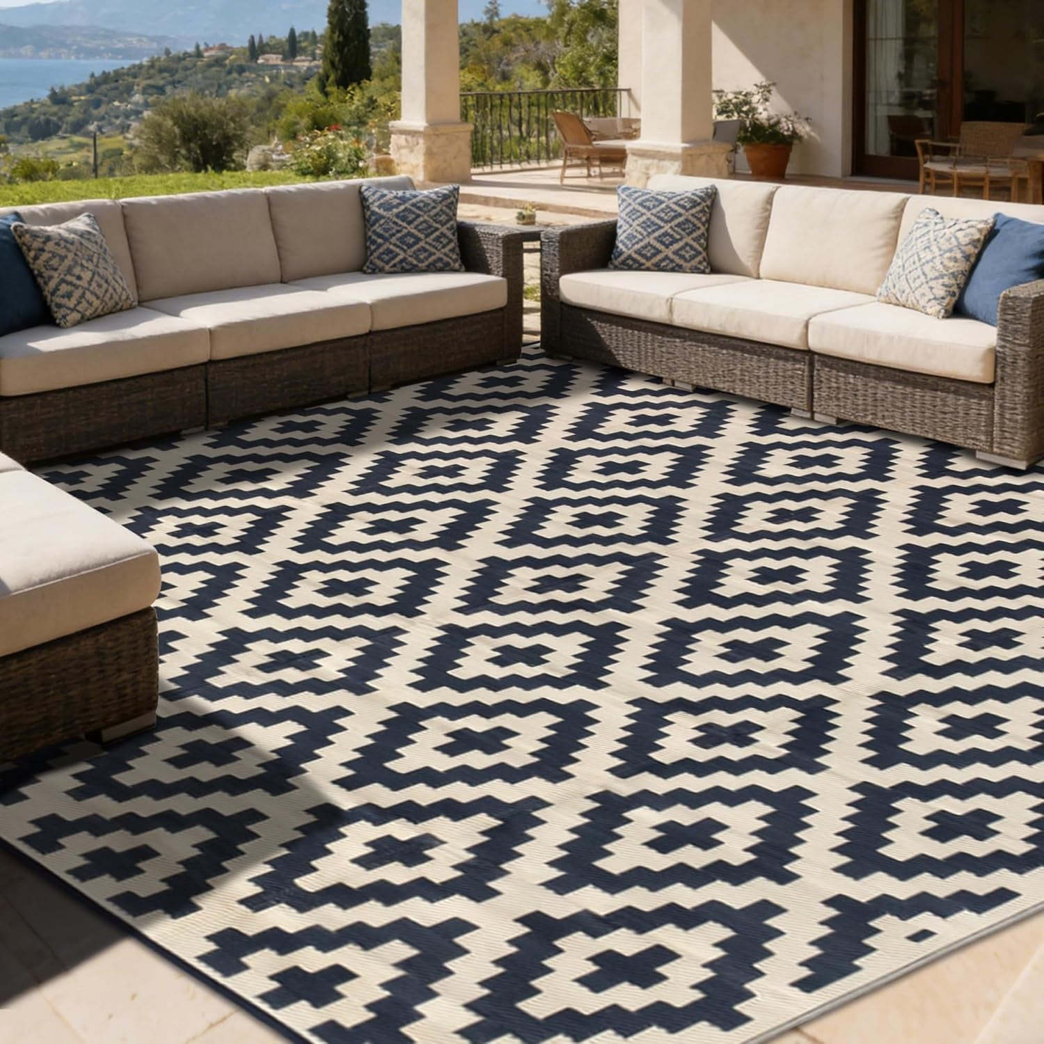 Spacious patio seating area framed by cream-and-navy geometric outdoor rug