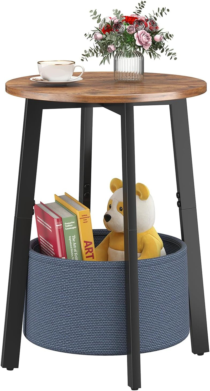 Single round side table with brown wood top, black metal legs and blue cloth basket holding books and a toy.