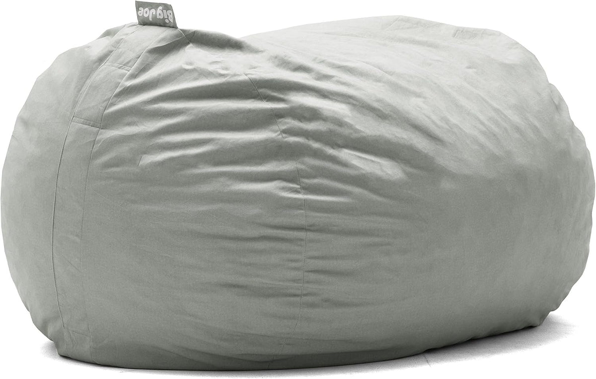 Side view of a large light gray round bean bag showing seams and fabric texture