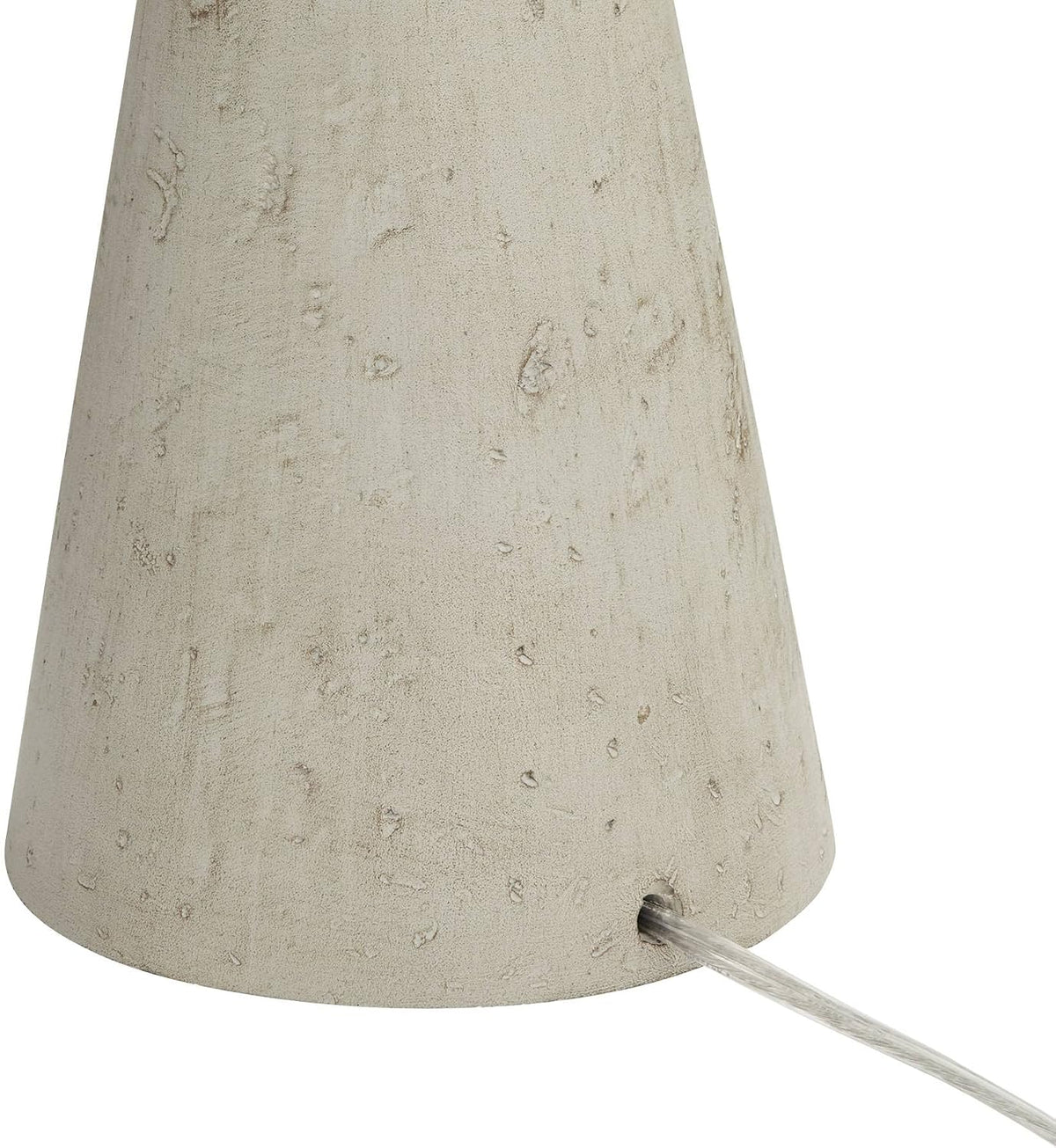 Lower base detail showing textured grey finish with clear power cord exiting a small hole