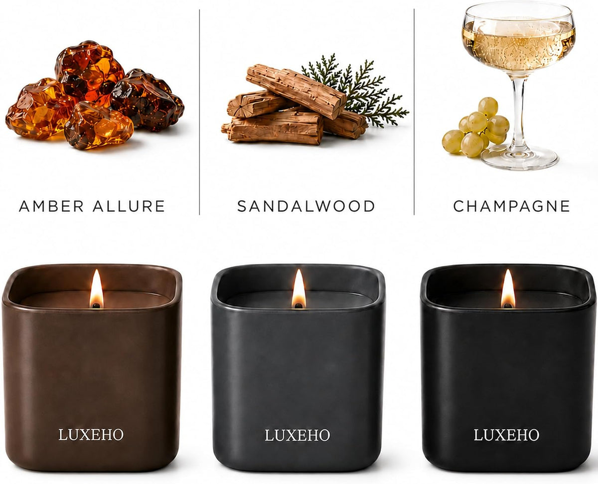 Close-up of three lit matte jars in brown, gray and black with illustrations for Amber Allure, Sandalwood and Champagne.