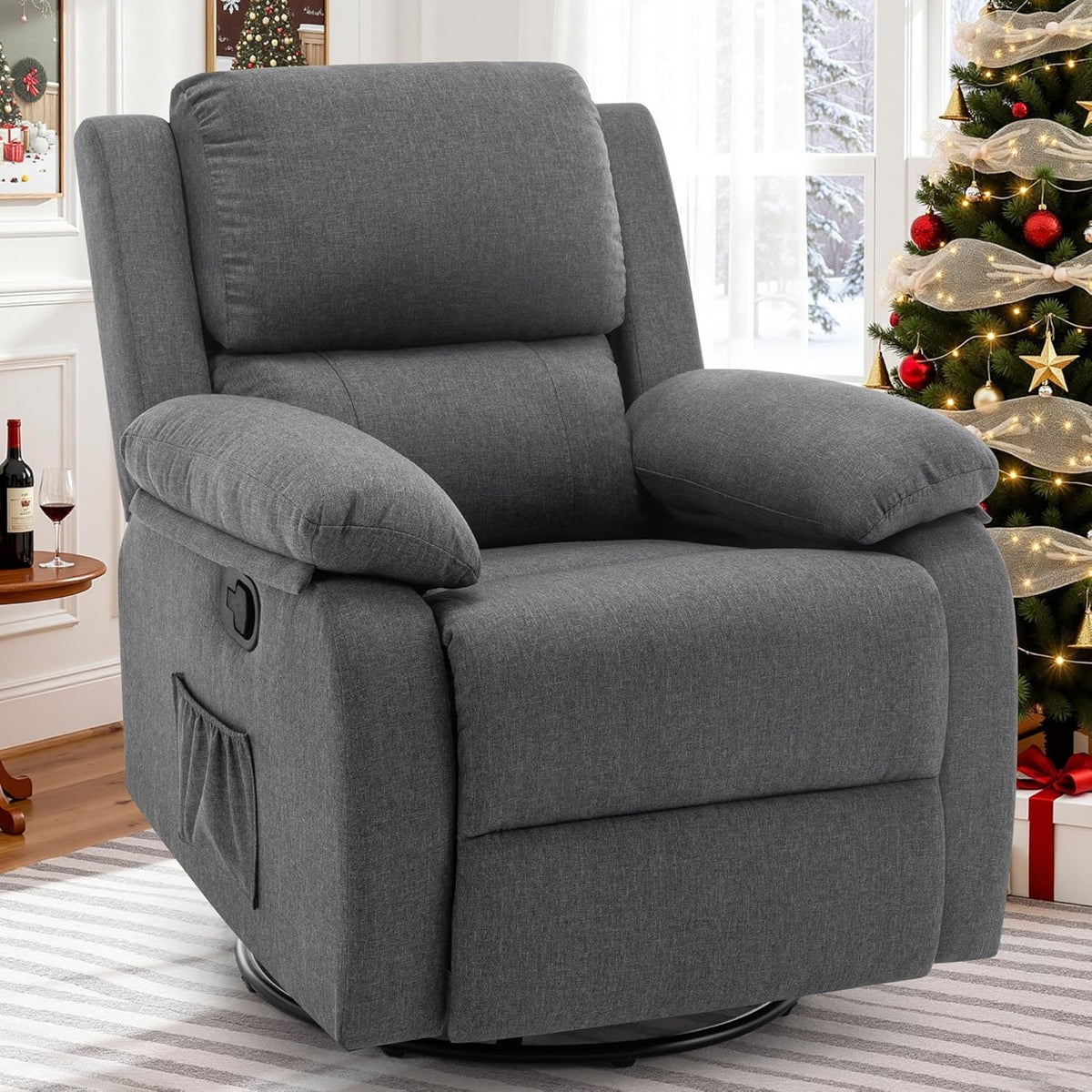 Front three-quarter view of a dark gray upholstered swivel recliner in a living room by a Christmas tree.