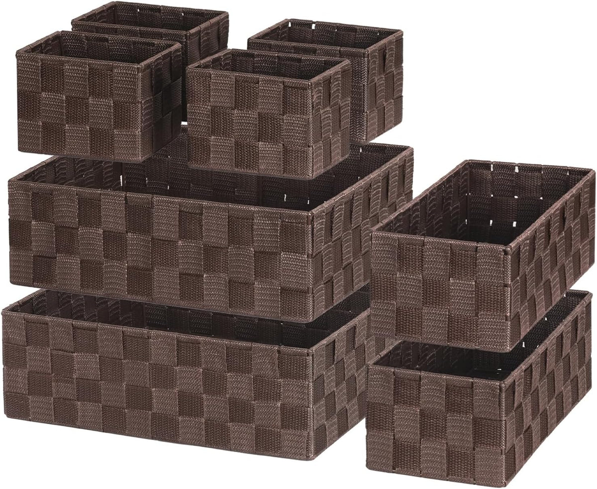 Brown woven polypropylene baskets grouped to show three small boxes perched over two larger trays