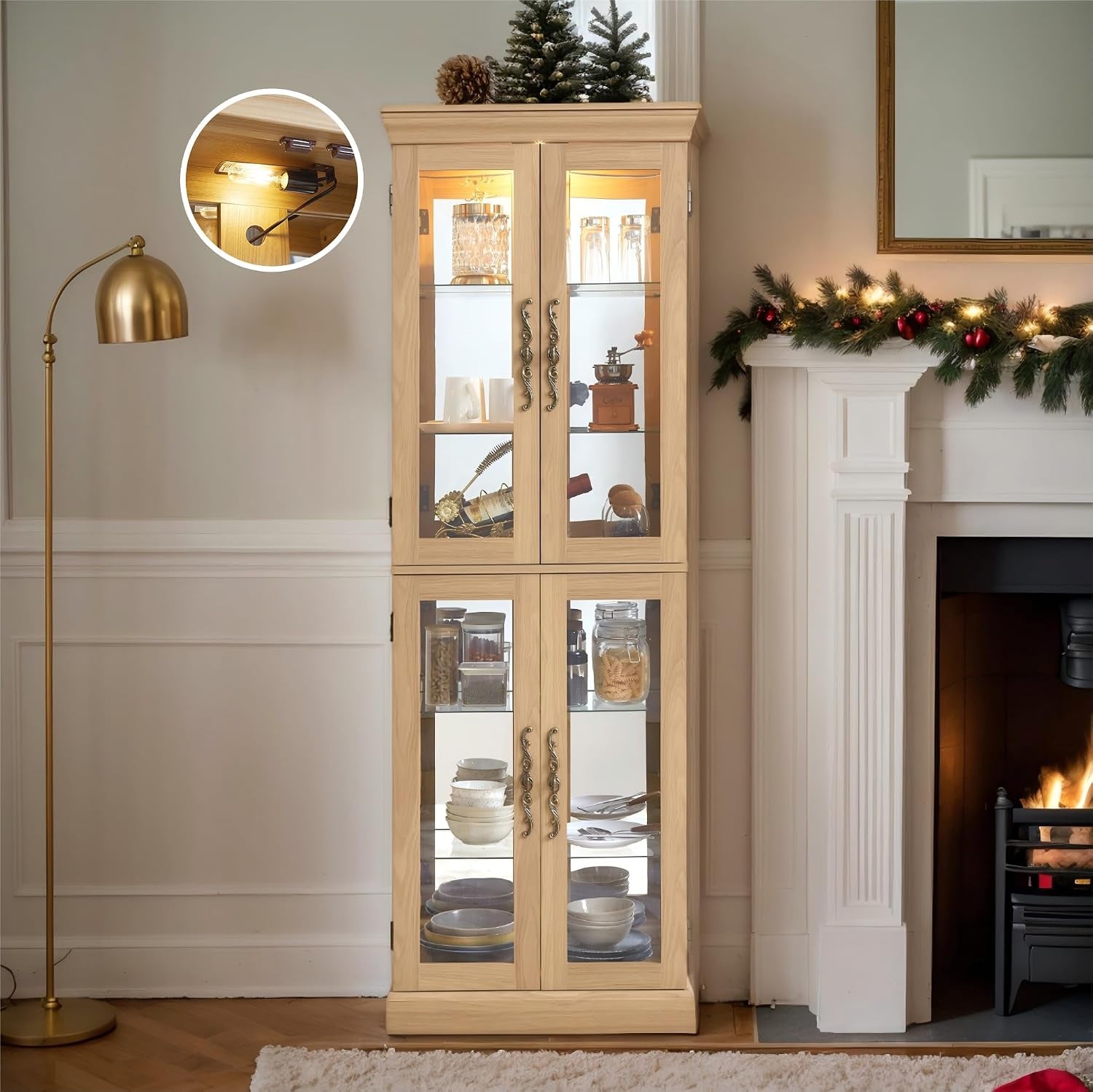 Tall natural-finish curio cabinet beside a fireplace, decorated with plates inside and holiday garland on the mantel.