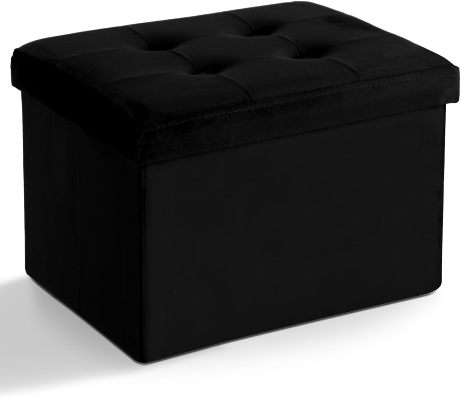 Three-quarter front view of a tufted rectangular black fabric storage ottoman casting a soft shadow.