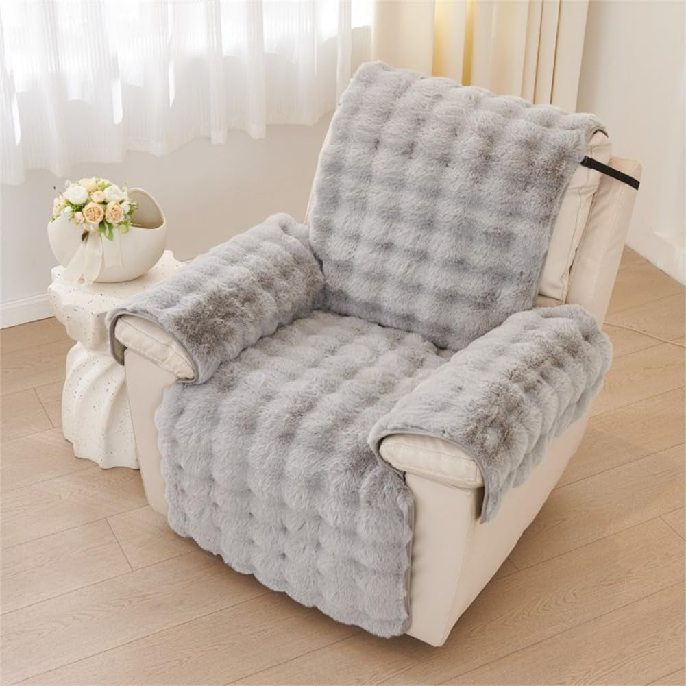 Light grey slipcover shown from a higher angle highlighting quilted tufting across seat and back.